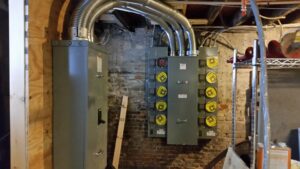 Recessed lighting and wall-mounted TV in a home theater installed by Gurley Electric LLC in Churchville, MD