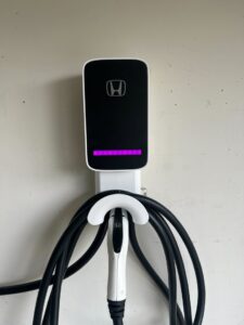 A new Honda electric vehicle charger installed on a wall by Zimmerman Electric Indy in Indianapolis, IN