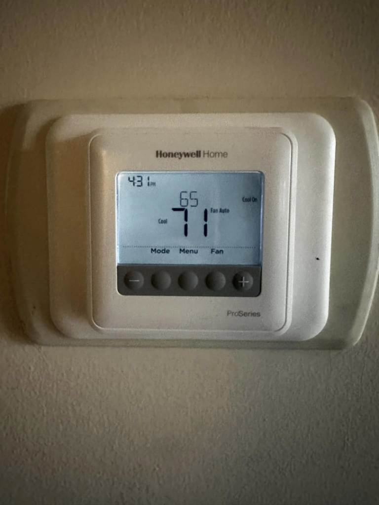 A Honeywell Home ProSeries thermostat displaying a cool setting of 71 degrees, installed by Adonis Hvac in Annapolis, MD.