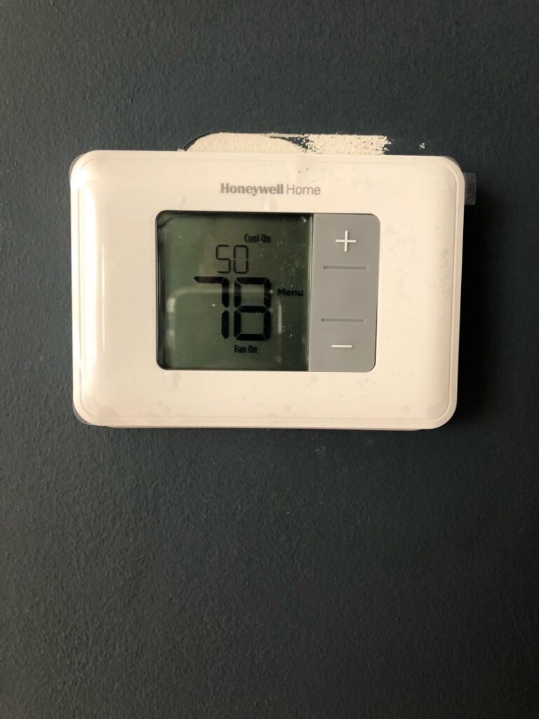 A Honeywell Home thermostat displaying 78 degrees, indicating cooling operation by Elements Heating & Cooling LLC in Minneapolis, MN.