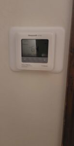 A Honeywell Home thermostat installed on a wall by David J. Winston Co. in Erie, PA.