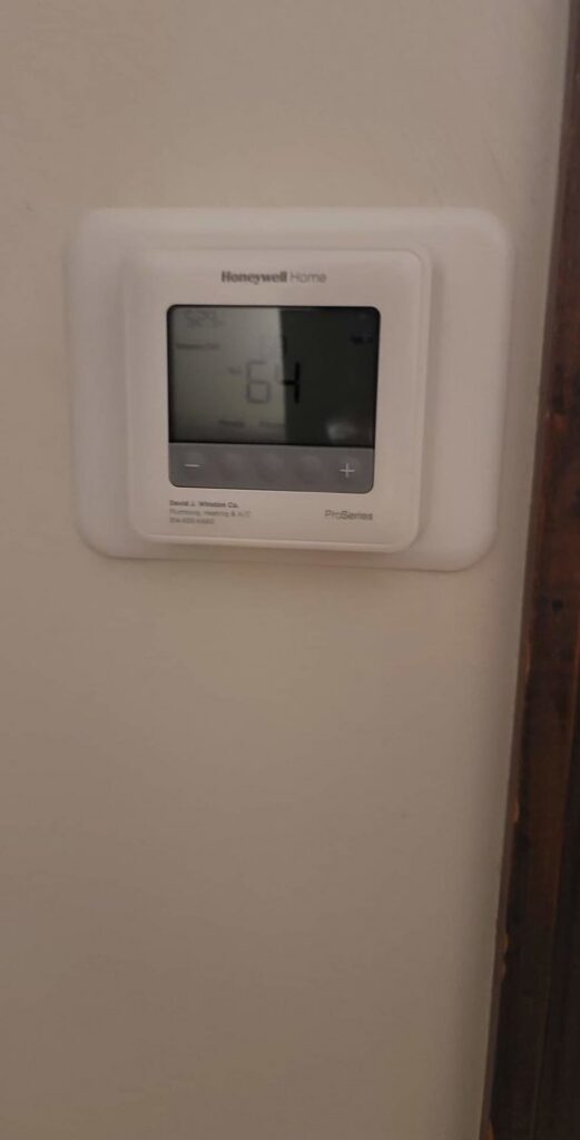 A Honeywell Home thermostat installed on a wall by David J. Winston Co. in Erie, PA.