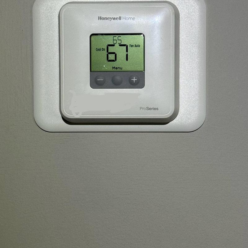 A Honeywell Home ProSeries thermostat displaying temperature settings, installed by Hodges Heating & Cooling in Owensboro, KY.