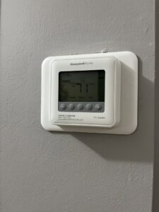 A Honeywell Home ProSeries thermostat displaying 73 degrees, installed by Krantz Kooling & Heating in West Columbia, SC