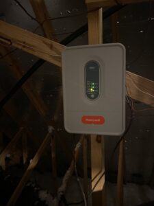 A Honeywell HVAC zone control panel installed in an attic by Reasonable Air, LLC in Summerville, SC.