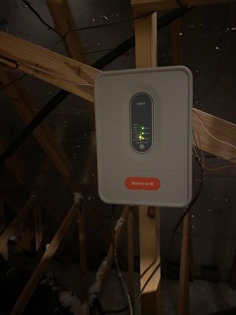 A Honeywell HVAC zone control panel installed in an attic by Reasonable Air, LLC in Summerville, SC.