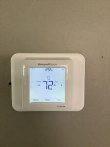 A Honeywell Home smart thermostat, installed by Family Heating & Air Conditioning, for climate control in Indianapolis, IN.