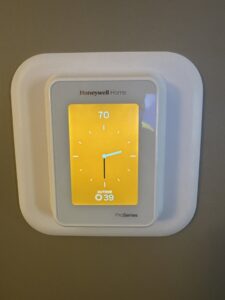 A modern Honeywell Home smart thermostat displaying 70 degrees, installed by JK Mechanical in Willow Street, PA.