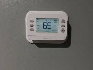 A Honeywell smart thermostat installed on a wall by Joe's Heating & Air Repair LLC in Surf City, NC