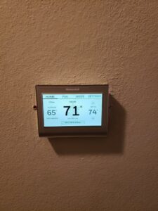 A Honeywell smart thermostat displaying indoor and outdoor temperatures, installed by The A/C Guy in Shreveport, LA.