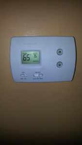 A Honeywell thermostat displaying a heat setting, serviced by Air Vent Master in Charlotte, NC.