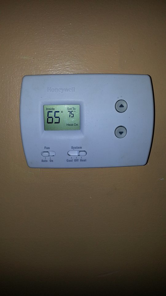 A Honeywell thermostat displaying a heat setting, serviced by Air Vent Master in Charlotte, NC.