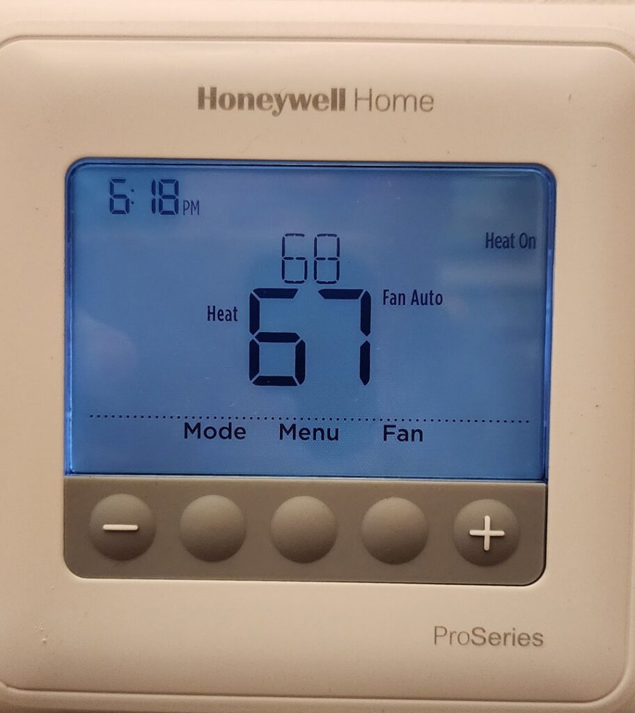 A Honeywell Home thermostat displaying temperature settings, installed by Tom's Heating Service in Waukesha, WI.