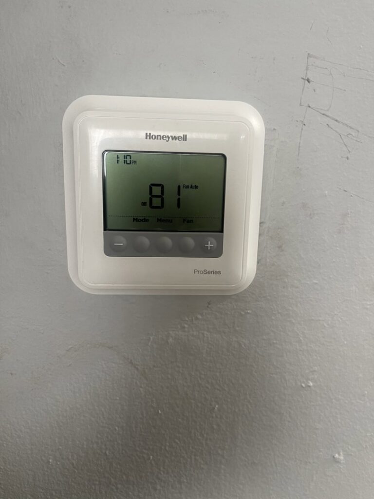 A newly installed Honeywell ProSeries thermostat by Wilcox Services in Temple Hills, MD.