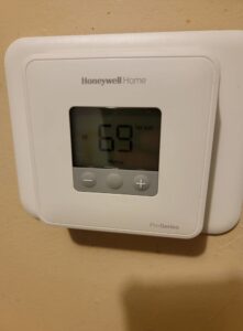 A Honeywell Home ProSeries thermostat installed by Working Wolves Heating & Cooling LLC in Lawrence, KS.
