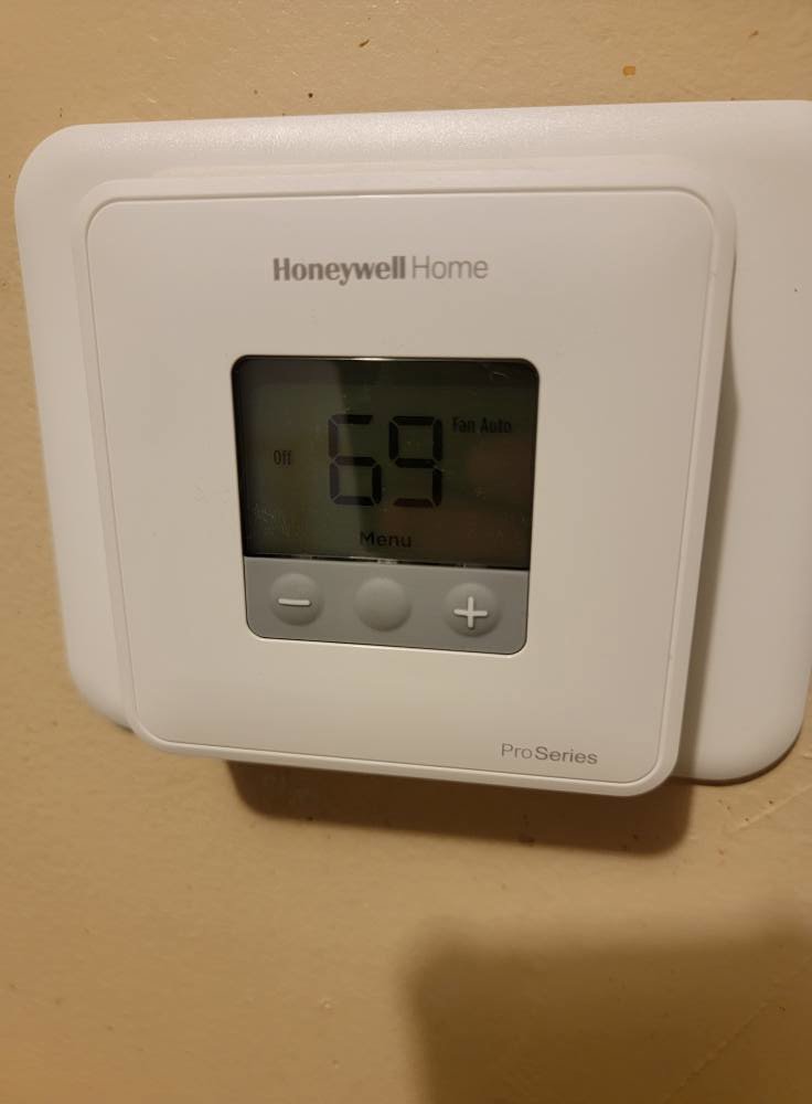 A Honeywell Home ProSeries thermostat installed by Working Wolves Heating & Cooling LLC in Lawrence, KS.