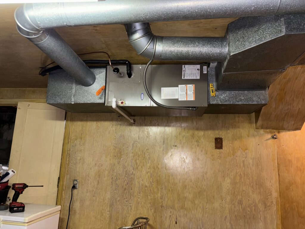 A horizontal furnace and air handler installation with ductwork by Nordic Air Heating & Cooling in West Allis, WI.