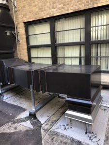 Horizontal rooftop HVAC ductwork supported by metal frames, installed by Kuhlmann Supply Company in Earth City, MO