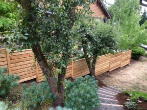 A newly installed horizontal slat fence by Pacific Woods Fence and Deck in Springfield, OR.
