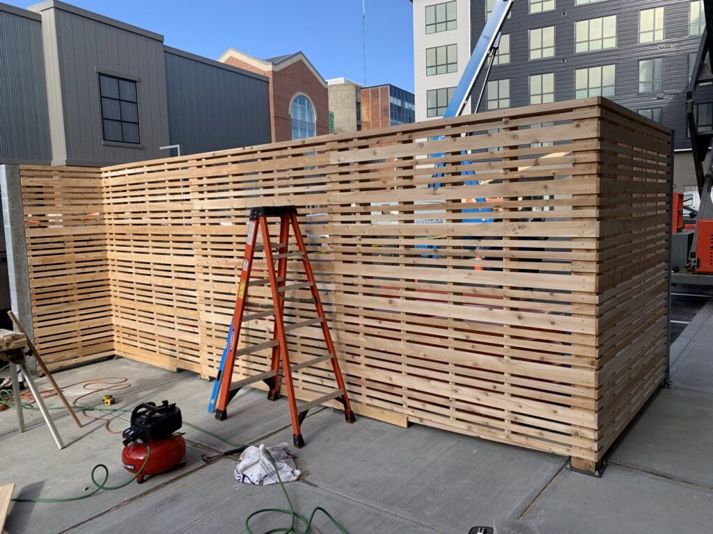 Horizontal slat wood fence under construction by Louis Fence installations & repairs in Fall River, MA