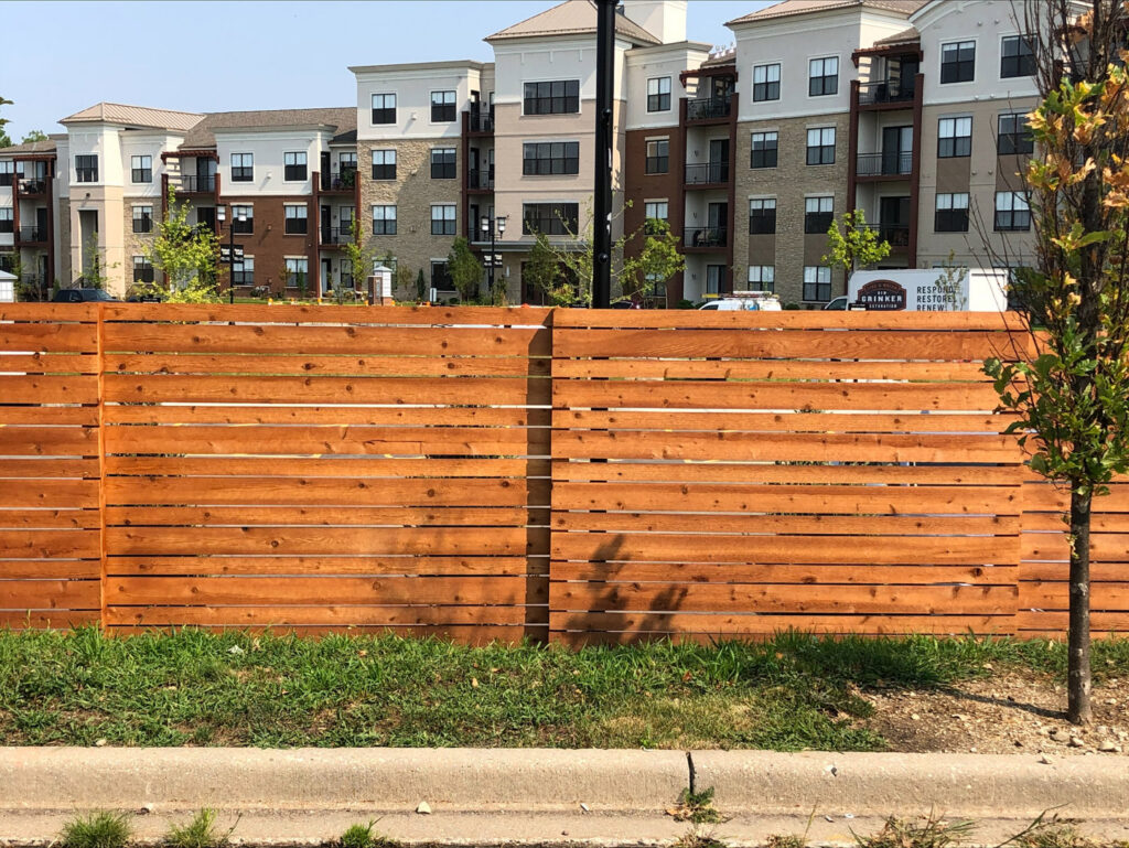 A modern horizontal slat wood fence installed by Northway Fence in Menomonee Falls, WI.