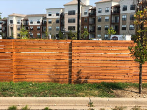 A modern horizontal slat wood fence installed by Northway Fence in Menomonee Falls, WI.