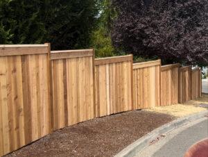 A modern horizontal slat wood privacy fence installed along a residential street by Clark County Fence LLC in Vancouver, WA.