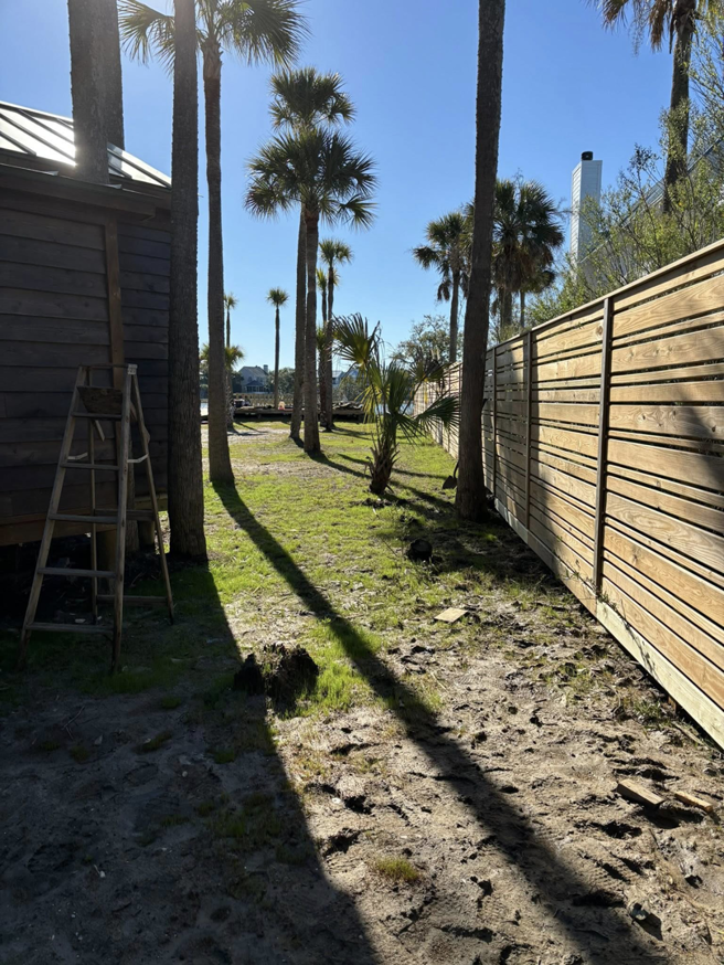 A newly installed horizontal slat wood privacy fence, expertly built by True Line Fencing LLC in Mount Pleasant, SC.