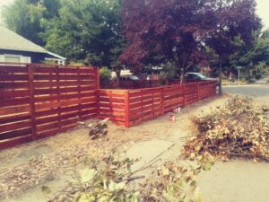 A modern horizontal slat wooden fence installed by Sacramento Valley Fencing in Sacramento, CA.