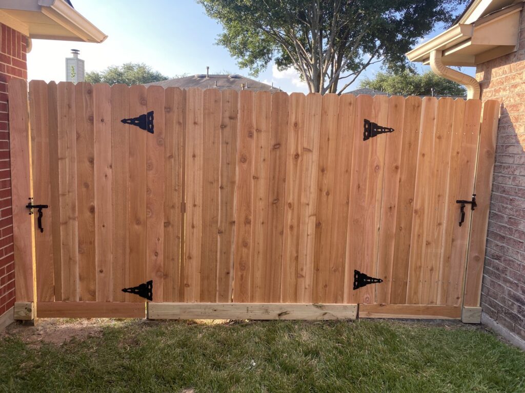 A modern horizontal wood fence with a matching gate, installed by Wood Fence Houston in Houston, TX.
