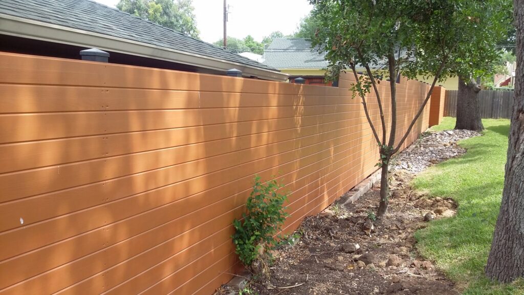 A modern horizontal wood plank privacy fence installed by Serrato's Fence & Welding in San Antonio, TX.