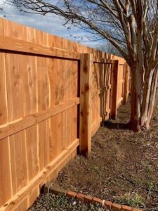 A modern horizontal wood privacy fence installed along a property line by America's Fencing in Nashville, TN.