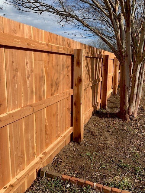 A modern horizontal wood privacy fence installed along a property line by America's Fencing in Nashville, TN.