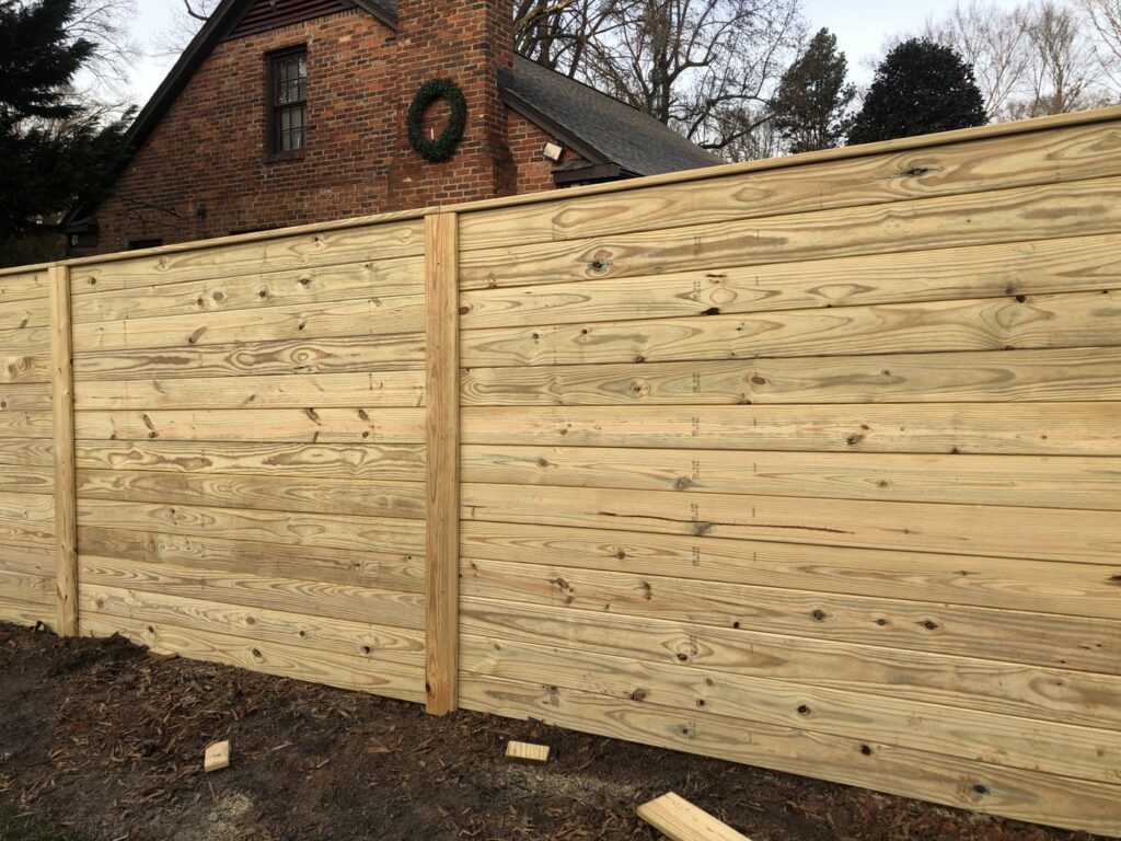 A modern horizontal wood privacy fence installed by Fenceitforu LLC in Matthews, NC.
