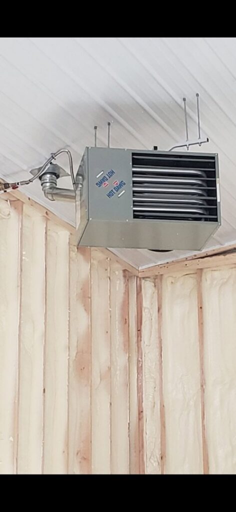 A 'Hot Dawg' garage heater installed on a ceiling by Preferred Heating & Air in Bismarck, ND.