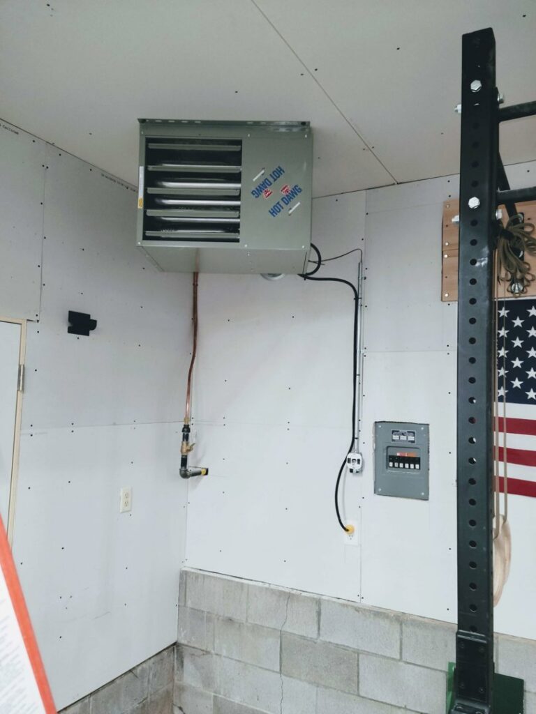 A 'Hot Dawg' garage heater installed on a wall, a heating service offered by TruTemp Heating & Cooling LLC in Ijamsville, MD.