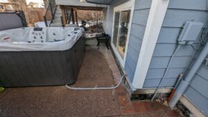 Outdoor hot tub with electrical conduit and wiring installed by Flowers Electric in Aurora, CO.
