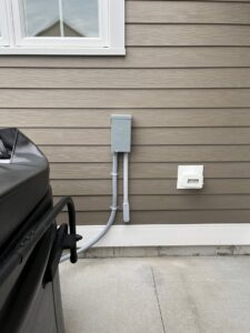 Outdoor electrical wiring and disconnect box installation for a hot tub by Russell Electric LLC in Saint Clair, MI