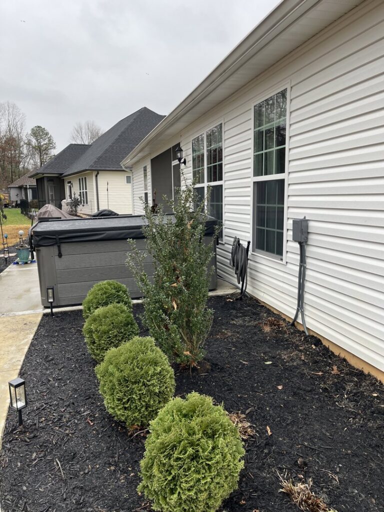 Exterior view of a house with a hot tub and visible electrical wiring installed by Shocking Solutions in Knoxville, TN.