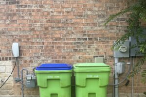 The exterior of a house showing a Tesla EV charger and electrical meter, installed by Davis Electric in Cleveland, OH.