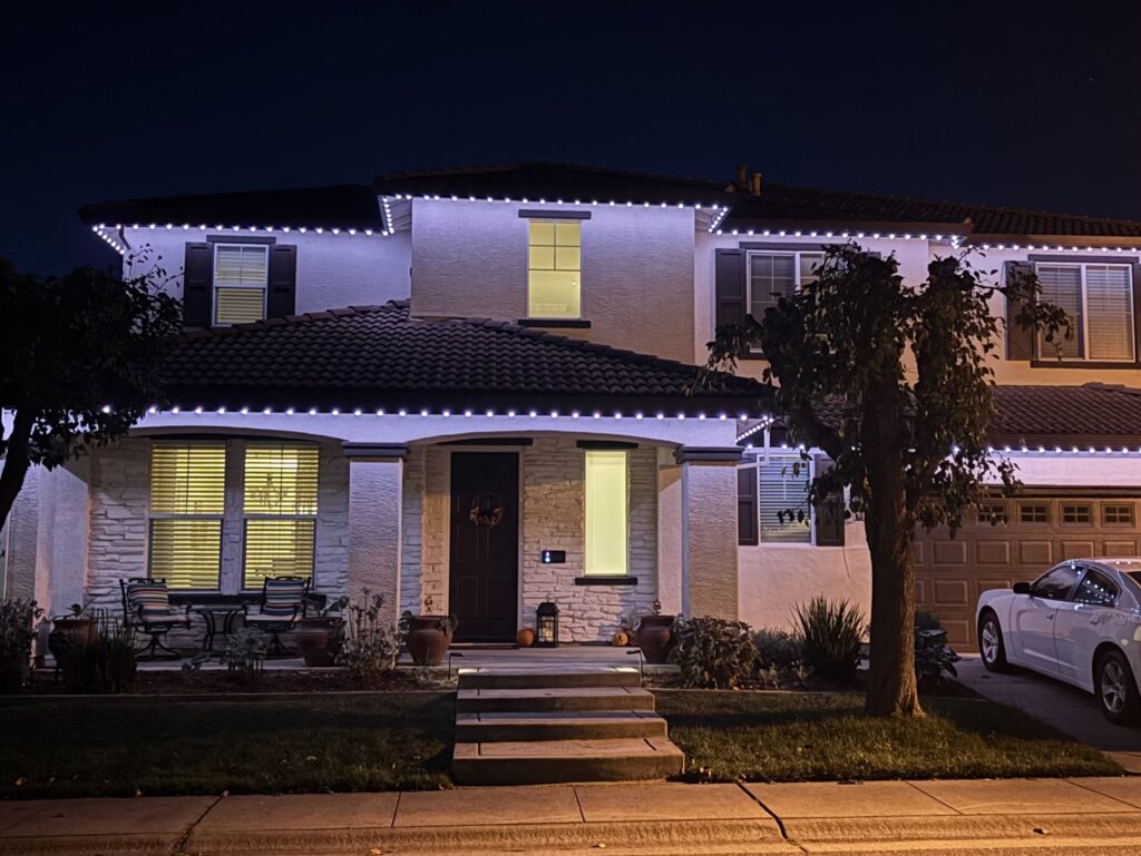 A house exterior featuring permanent holiday lighting installed by The Lighting Geek in Sacramento, CA.