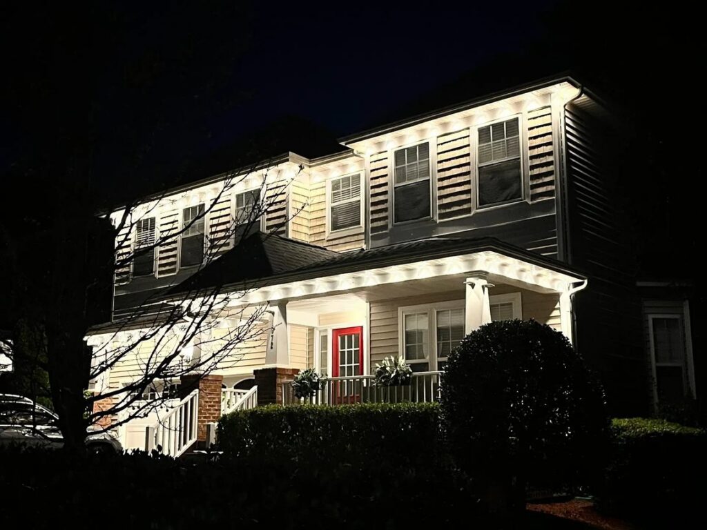 House exterior illuminated by newly installed soffit lighting by Clarity Handyman Service in Raleigh, NC