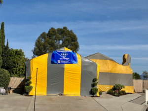 A house undergoing fumigation for termite control by MVP Solutions Pest Inc. in Temecula, CA.