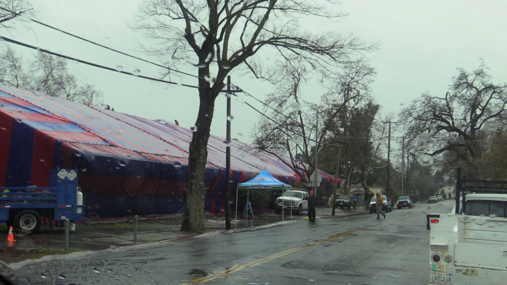 A residential house covered by a large fumigation tent for termite control by Millennium Termite & Pest in Sacramento, CA