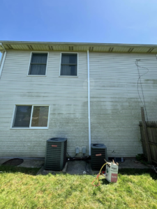 Outdoor AC condenser units with refrigerant tank during service or installation by Fast Air in Zebulon, NC