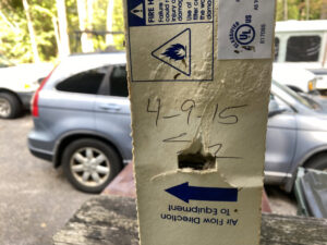 An HVAC air filter showing an installation date and airflow direction, indicating proper service by Lee Air Conditioning in Lafayette, LA.