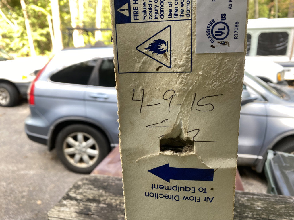 An HVAC air filter showing an installation date and airflow direction, indicating proper service by Lee Air Conditioning in Lafayette, LA.