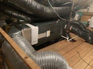 An HVAC air handler and ductwork installation in a utility space by Freedom Air Mechanical Contractors LLC in Everett, MA.