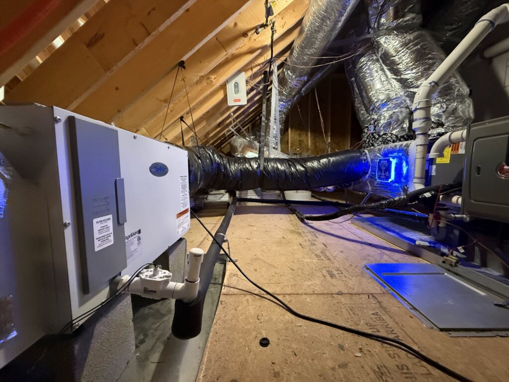 HVAC air handler and ductwork installed in an attic by Reliable Heating and Air in Knightdale, NC