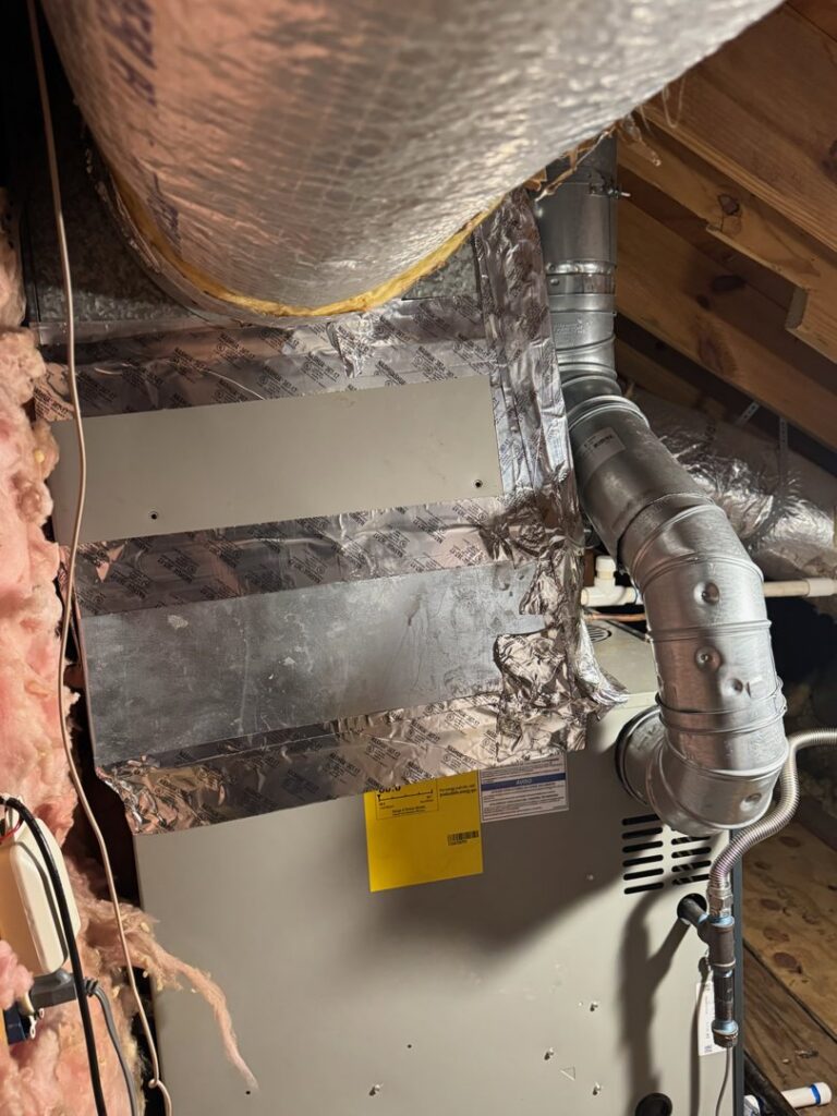An HVAC air handler unit installed in an attic space with ductwork by C&K Air and Heating, Inc. in Olive Branch, MS.